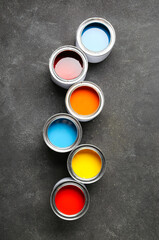 Cans of paints on grunge background
