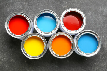 Cans of paints on grunge background