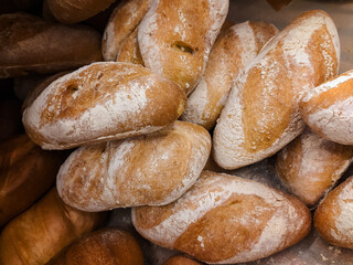 Bread on a shelf in a bakery store.