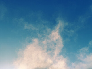 White mist against blue sky