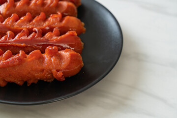 deep fried sausage skewer on plate