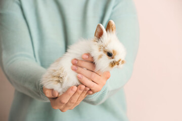 Obraz premium Woman with cute rabbit, closeup