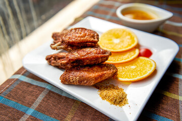 A close-up of a golden tempting deep-fried chicken wings