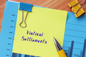  Financial concept about Viatical Settlements with inscription on the sheet.
