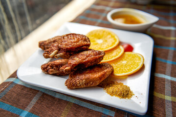 A close-up of a golden tempting deep-fried chicken wings