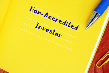  Financial concept meaning Non-Accredited Investor with phrase on the piece of paper.