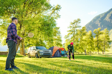 Fototapeta premium people playing in badminton on the campground