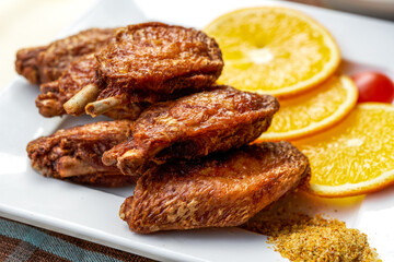 A close-up of a golden tempting deep-fried chicken wings