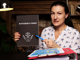 Fototapeta premium Legal concept meaning Dangerous Foods with sign on the piece of paper.