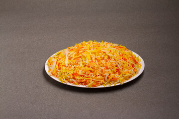 Indian vegetable pod pulav or biryani made from basmati rice, served in a white bowl . selective focus