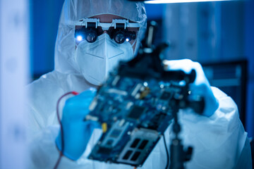 Microelectronics engineer works in a modern scientific laboratory on computing systems and...