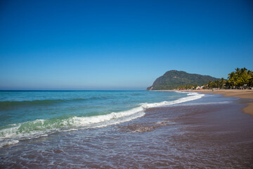 Waves breaking on the beach of the Pacific Ocean in Lo de Marcos, Riviera Nayarit, Mexico.