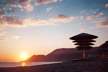 Beautiful landscape. Traveling by Turkey. Sea Beach with sunloungers and umbrellas.