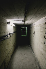 Dark corridor of old abandoned Soviet underground bunker. Defocused