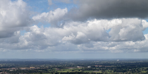 Panoramic views of the British countryside, with a lot of white fluffy clouds 