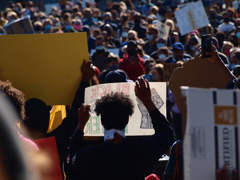 Black Lives Matter rally man holds up sign