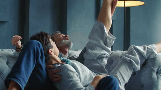 aged couple sitting on the sofa