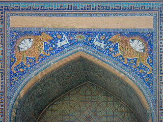 Beautiful mosaic with tiger and sun symbol on iwan of Sher Dor madrassa in UNESCO listed Samarkand, Uzbekistan