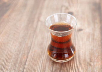On the table is a cup of freshly brewed Turkish black tea