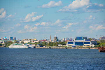 Passenger river port in Kazan on the Volga River. Tatarstan, Russia. A sunny summer day. Two three-deck passenger ships in the background.