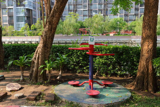 Waist twisting machine, outdoor exercise equipment, installed on cement base in the garden
