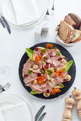 Sliced Beef or Pork with Marinated Vegetables and Sauce. Beautifully decorated catering banquet menu. Food snacks and appetizers for buffet on white background