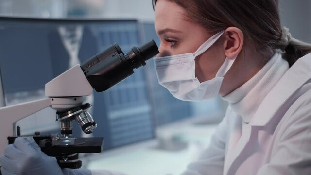 Female doctor working in laboratory. Studying human skeleton dna DNA samples