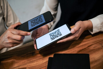 Qr code payment. Woman scanning QR code online shopping cashless technology concept.