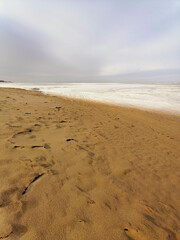 footprints on the sand, sand on the sea beach