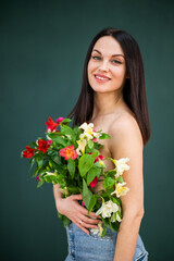 beautiful girl with dark hair and flowers instead of clothes