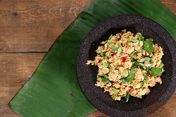 Sambel tempe or sambal tempeh is traditional indonesian culinary food made from crushed fried tempeh, grated coconut, mlanding and basil leaf.
