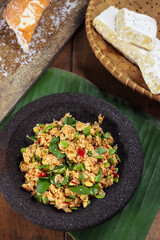 Sambel tempe or sambal tempeh is traditional indonesian culinary food made from crushed fried tempeh, grated coconut, mlanding and basil leaf.