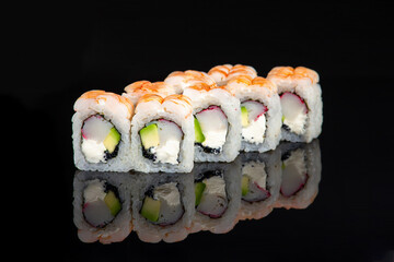 shrimp sushi roll on black