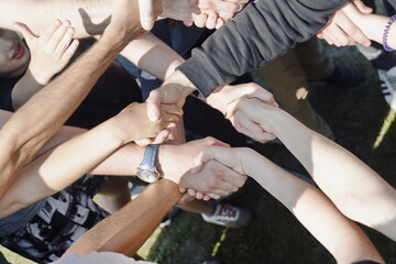 large group of people greet and shake hands 