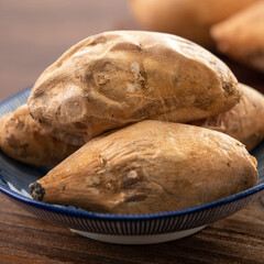 Homemade delicious roasted sweet potato in a plate for eating.