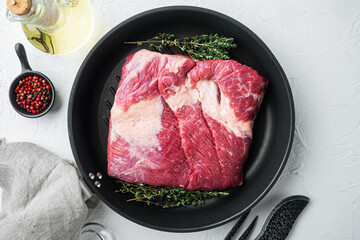 Beef navel, raw beef brisket meat,with ingredients for smoking  making  barbecue, pastrami, cure, on white stone  background, top view flat lay