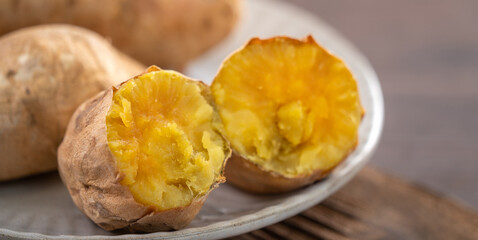 Homemade delicious roasted sweet potato in a plate for eating.