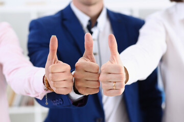 Group of people show OK or approval with thumb up during conference closeup. High level quality product, serious offer, excellent education, mediation solution, creative advisor participation concept