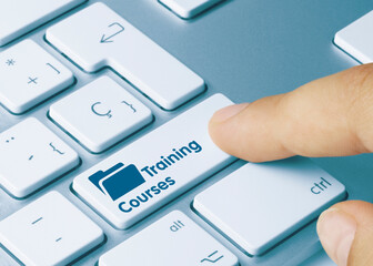 Training Courses - Inscription on Blue Keyboard Key.