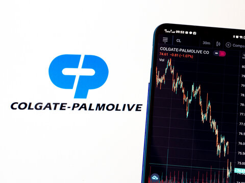 In this photo illustration the stock market information of Colgate-Palmolive Company displays on a smartphone while the logo of Colgate-Palmolive Company displays as the background