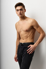 Handsome man with naked torso posing self-confidence model