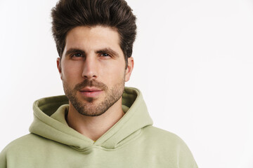 Obraz premium Young handsome man in sportswear posing and looking at camera