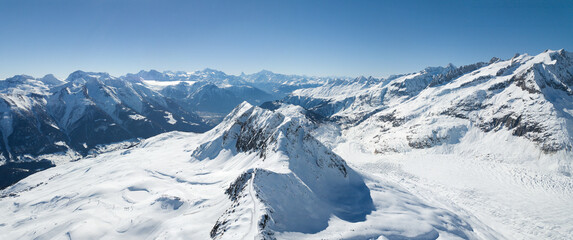 Elselicka Ridge seperates the Great Aletsch Glacier and Fiesch valley, aerial view from Eggishorn. Elselcka Arête is a very challenging hiking route along the Aletsch Glacier. (large stitched file)