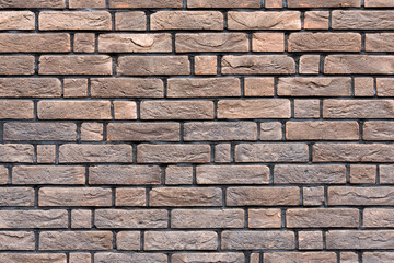 Brown brick wall texture. Grungy brickwall. Exterior or loft style bricks texture background