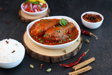 Spicy red Indian Chicken curry tikka masala Chicken leg curry Korma gravy dish Hyderabad India Pakistan . hot non-vegetarian food Indian spices side dish chapati, roti, paratha. - obrazy, fototapety, plakaty