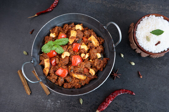  Mutton roast curry , meat beef roast curry 4K slow motion video footage Kerala India Sri Lanka Pakistan Chukhandar gosht spicy delicious traditional homemade with Indian spices coconut pieces cashew 