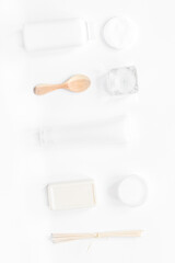 body care concept with white set of cosmetics woman desk top view