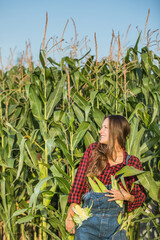 Female farmer or gardener holding her crop fresh vegetable. Agriculture -food production, harvest concept	