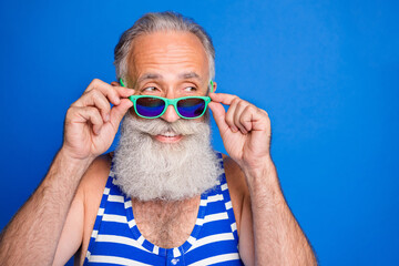 Photo of happy cheerful good mood tricky cunning old man hold sunglasses look copyspace isolated on...