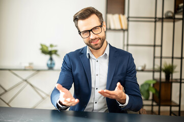 Noble handsome businessman talking about startup, company entrepreneur sitting, smiling with...